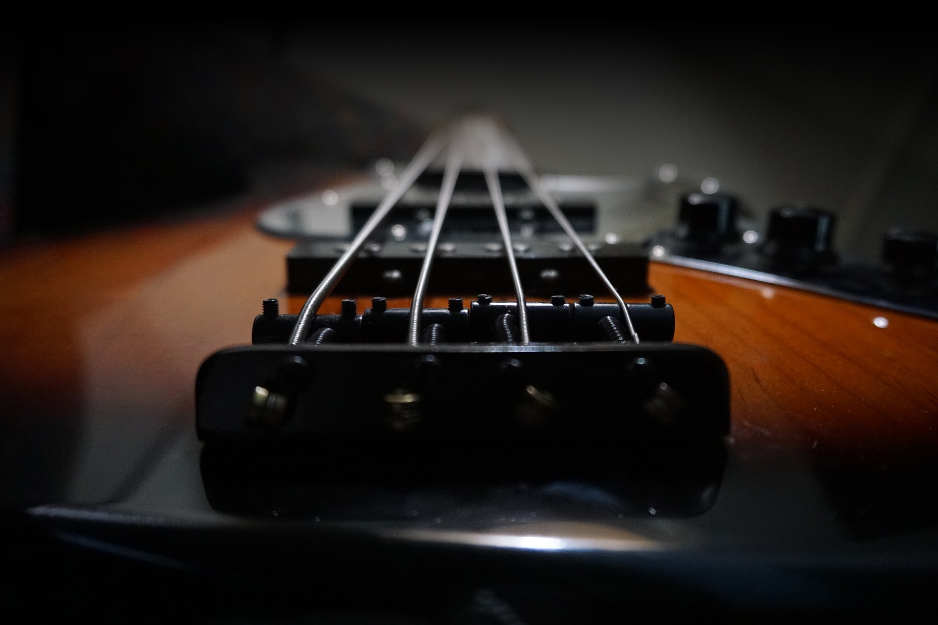image of electric bass looking up from bridge
