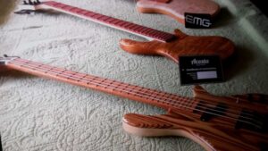 multiple basses laid on table